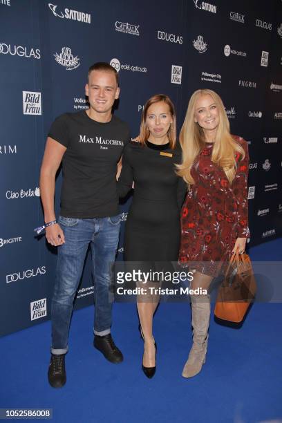 German actress Jenny Elvers with her son Paul Jolig and center manager Ludmila Brendel attend the Late Night Shopping party on October 19, 2018 in...