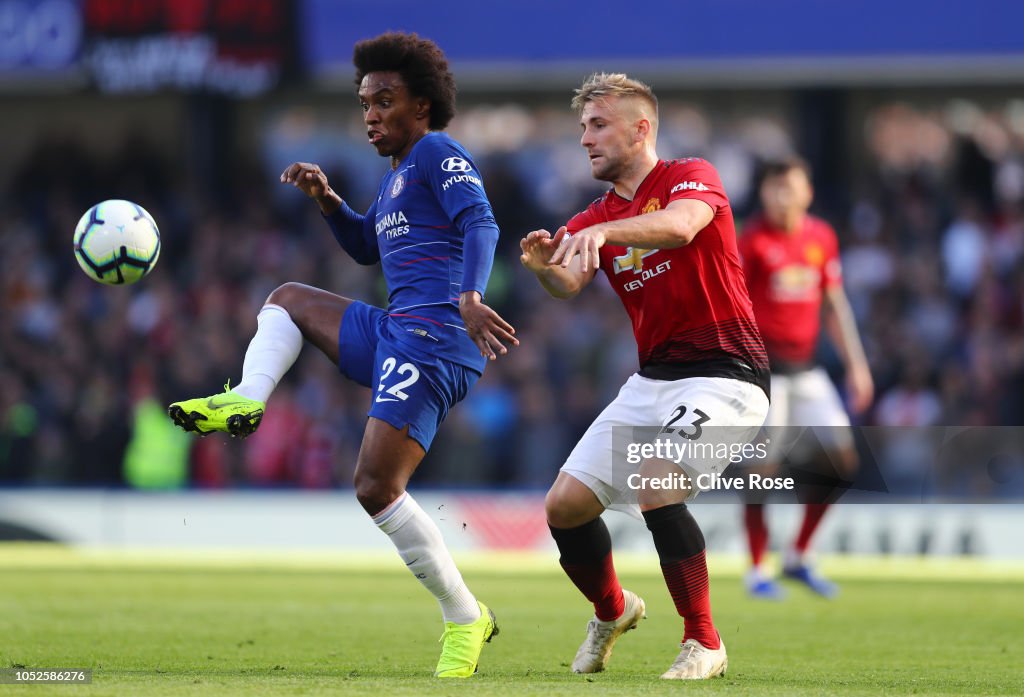 Willian of Chelsea is challenged by Luke Shaw of Manchester United ...