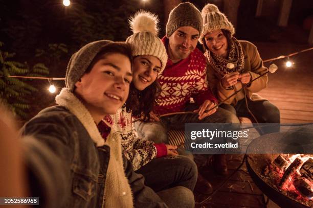 one selfie for social networks - outdoor fireplace home stock pictures, royalty-free photos & images