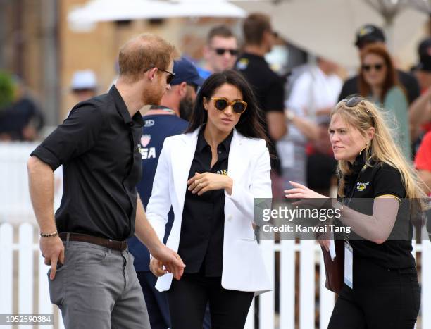 Prince Harry, Duke of Sussex with Meghan, Duchess of Sussex and her assistant Amy Pickerill attend the Invictus Games Sydney 2018 Jaguar Land Rover...