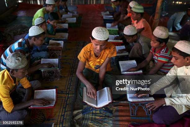 Rohingya boys attend religious studies at a madrassa in the Kutupalong camp in Cox's Bazar, Bangladesh, October 16, 2018.