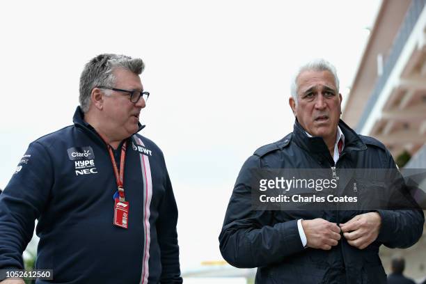 Otmar Szafnauer, Team Principal and Chief Executive Officer of Force India walks with Lawrence Stroll in the Paddock before final practice for the...