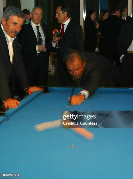 Party goers at the Esquire Apartment enjoy a game of pool in a room designed by Jamie Drake