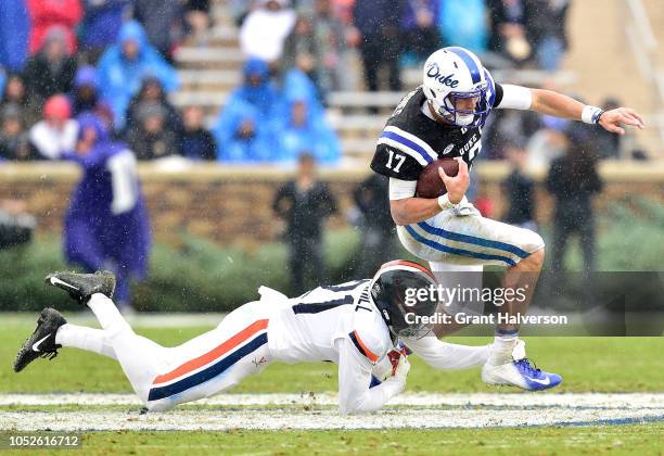 Juan Thornhill of the Virginia Cavaliers tackles Daniel Jones of the Duke Blue Devils during their game at Wallace Wade Stadium on October 20, 2018...