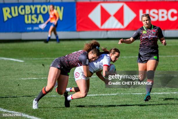 England's Ellie Kildunne tackles USA's Steph Rovetti during the HSBC USA Women's Sevens rugby tournament at Infinity Park on , October 20, 2018 in...