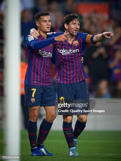 Lionel Messi and Philippe Coutinho of Barcelona celebrates the second goal during the La Liga match between FC Barcelona and Sevilla FC at Camp Nou...