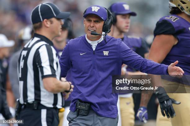 Head coach Chris Petersen of the Washington Huskies lobbies the referee for a penalty call during the game against the Colorado Buffaloes at Husky...