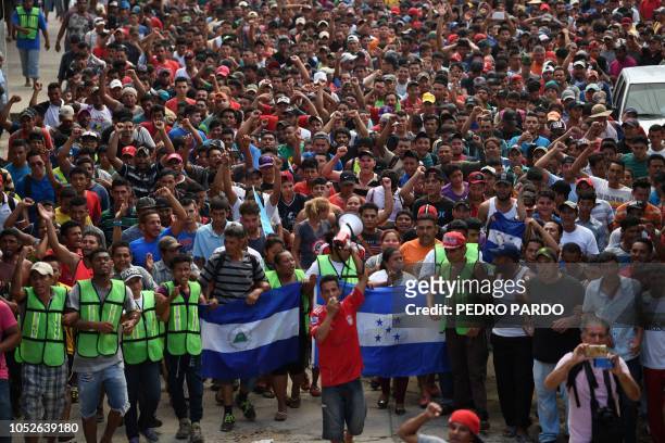 Honduran migrants heading in a caravan to the US, hold a demonstration demanding authorities to allow the rest of the group to cross, in Ciudad...
