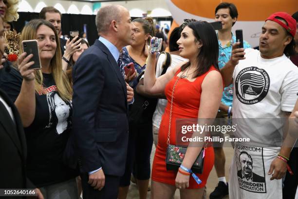 Michael Avenatti and Laura Loomer attend Politicon 2018 at Los Angeles Convention Center on October 20, 2018 in Los Angeles, California.