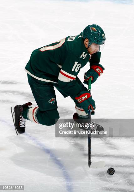 Matt Read of the Minnesota Wild skates with the puck during a game between the Minnesota Wild and Tampa Bay Lightning at Xcel Energy Center on...