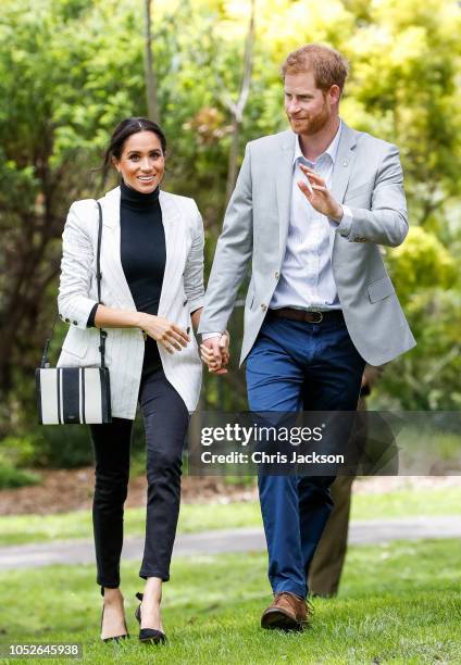 Prince Harry, Duke of Sussex and Meghan, Duchess of Sussex during day two of the Invictus Games Sydney 2018 at Sydney Olympic Park on October 21,...