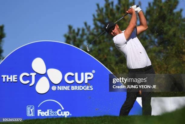 Brooks Koepka of the US tees off on the fourth hole during the final round of the CJ Cup golf tournament at Nine Bridges golf club in Jeju Island on...