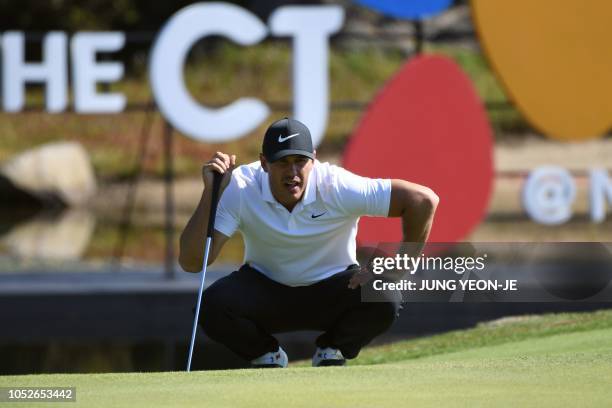 Brooks Koepka of the US looks over the green on the seventh hole during the final round of the CJ Cup golf tournament at Nine Bridges golf club in...