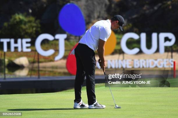 Brooks Koepka of the US putts on the seventh hole during the final round of the CJ Cup golf tournament at Nine Bridges golf club in Jeju Island on...