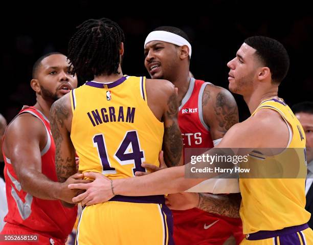Carmelo Anthony and Eric Gordon of the Houston Rockets restrain Brandon Ingram of the Los Angeles Lakers with the help of Lonzo Ball during a 124-115...