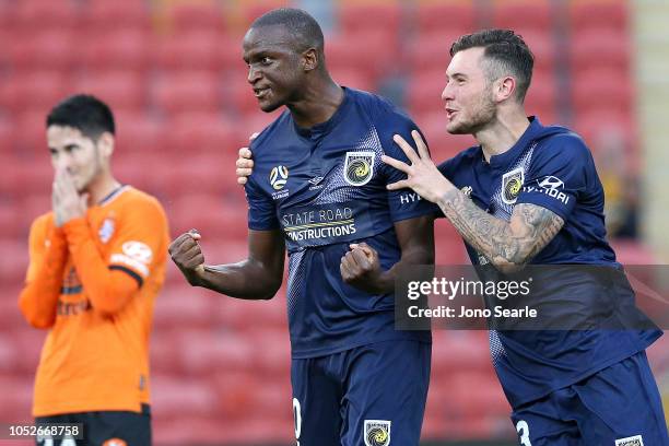 Kalifa Cisse of the Mariners and team mate Aiden ONeill celebrate a goal that was given offside and not allowed during the round one A-League match...