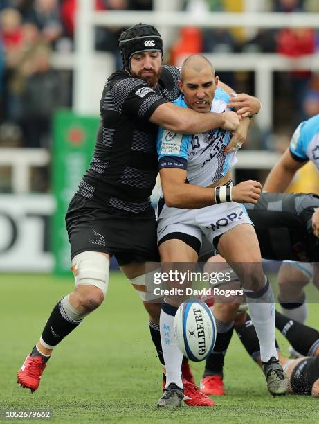 Ruan Pienaar of Montpellier is held by Gary Graham during the Champions Cup match between Newcastle Falcons and Montpellier Herault Rugby at Kingston...