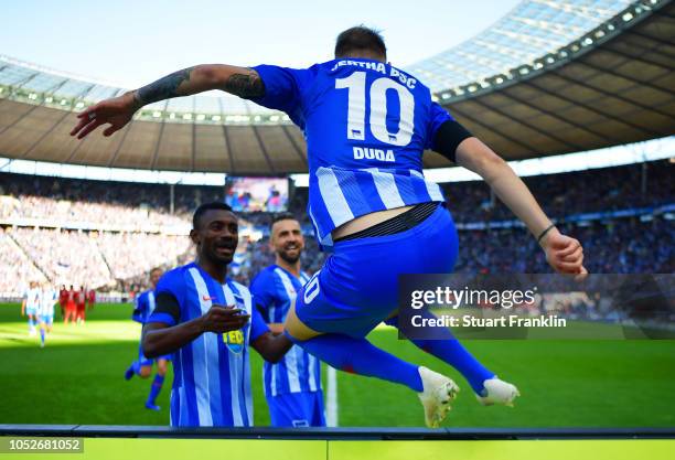 Ondrej Duda of Hertha BSC jumps the hoardings as he celebrates scoring his team's first goal with team mate Salomon Kalou during the Bundesliga match...