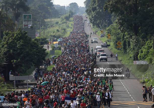 Migrant caravan walks into the interior of Mexico after crossing the Guatemalan border on October 21, 2018 near Ciudad Hidalgo, Mexico The caravan of...