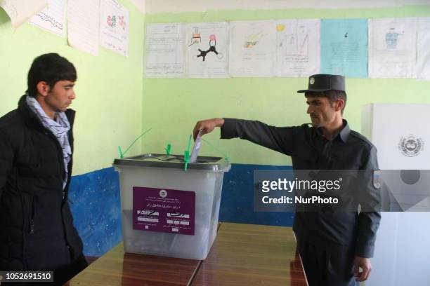 An Afghan man casts her vote at a polling center in Badakhshan, Afghanistan, 20 October 2018. According to the Independent Election Commission about...