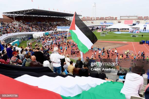 People support Palestinian athlete Mohammed Al Kadi competing for Palestinians in Amsterdam Marathon in Amsterdam, Netherlands on October 21, 2018.