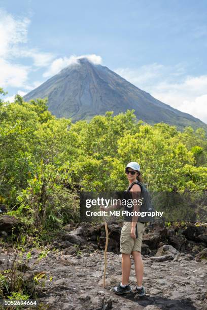 woman hiking arenal 1968 trail - arenal volcano national park stock pictures, royalty-free photos & images