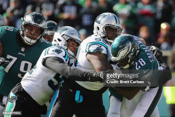 Defensive tackle Kawann Short of the Carolina Panthers tackles running back Wendell Smallwood of the Philadelphia Eagles during the second quarter at...