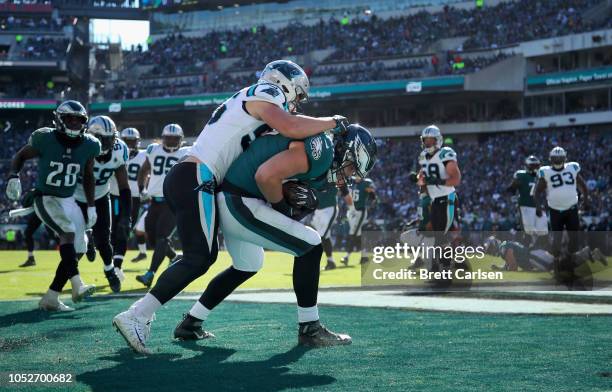 Tight end Dallas Goedert of the Philadelphia Eagles makes a touchdown reception against linebacker David Mayo of the Carolina Panthers during the...