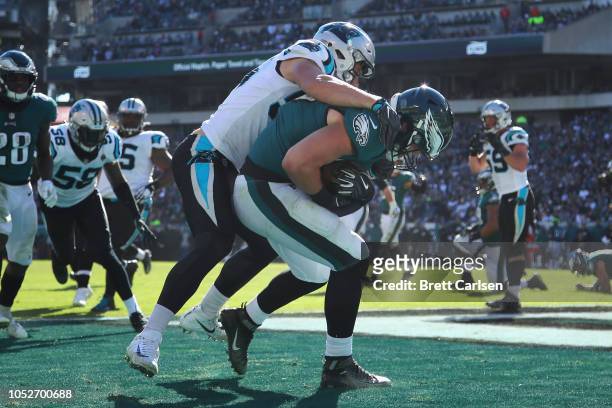 Tight end Dallas Goedert of the Philadelphia Eagles makes a touchdown reception against linebacker David Mayo of the Carolina Panthers during the...