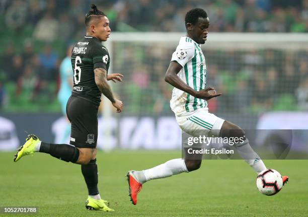 Cristian Ramirez of FC Krasnodar vies for the ball with Ablaye Mbengue of FC Akhmat Grozny during the Russian Premier League match between FC...