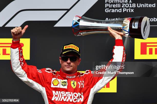 Race winner Kimi Raikkonen of Finland and Ferrari celebrates on the podium during the United States Formula One Grand Prix at Circuit of The Americas...