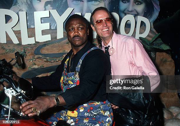 Joe Frazier and Peter Fonda during Grand Opening of The Harley Davidson Cafe at Harley Davidson Cafe in New York City, New York, United States.