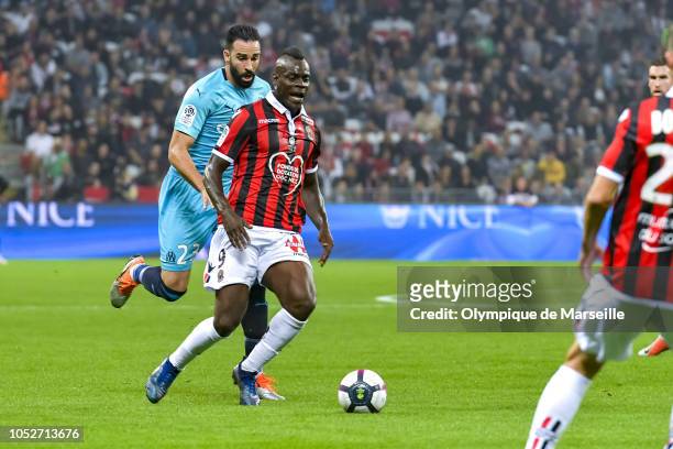 Adil Rami of Olympique de Marseille and Mario Balotelli of OGC Nice fight for the ball during the Ligue 1 match between OGC Nice and Olympique de...