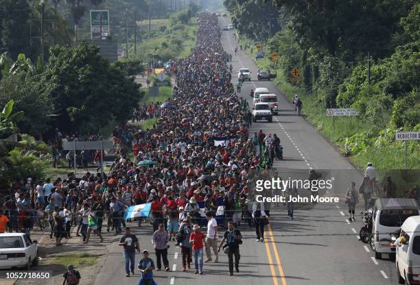 Migrant caravan, which has grown into the thousands, walks into the interior of Mexico after crossing the Guatemalan border on October 21, 2018 near...
