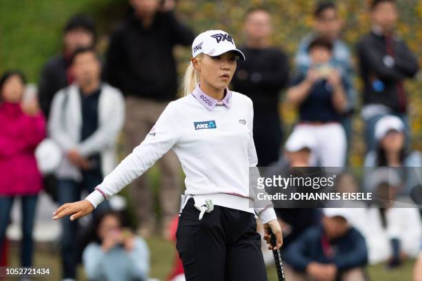 This picture taken on October 21, 2018 shows Lydia Ko of New Zealand reacting at the Shanghai LPGA golf tournament in Shanghai. - Lydia Ko made...