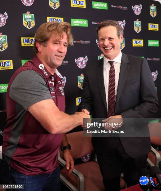 Des Hasler shakes hands with Chairman Scott Penn during a Manly Sea Eagles NRL press conference at Narrabeen on October 22, 2018 in Sydney, Australia.