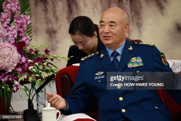 China's Vice Chairman of the Central Military Commission Xu Qiliang speaks to Germany's Defense Minister Ursula von der Leyen during their meeting at...