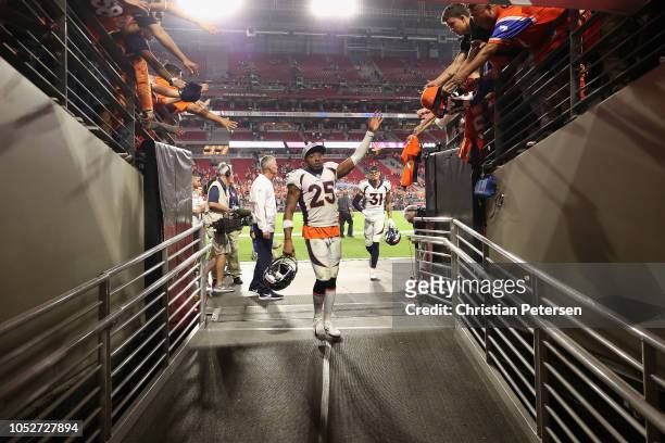 Cornerback Chris Harris of the Denver Broncos waves to fans as he leaves the field following the NFL game against the Arizona Cardinals at State Farm...