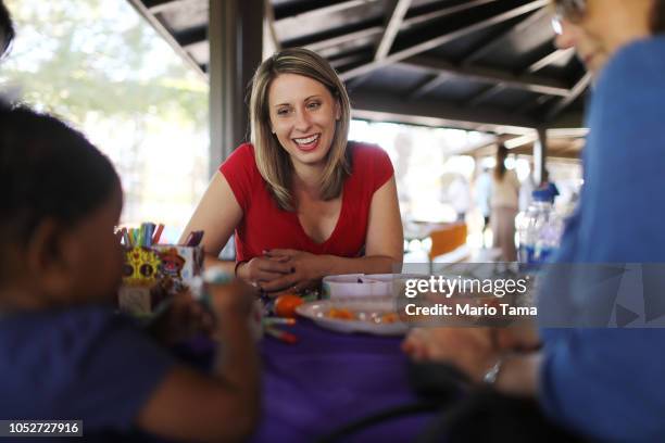 Democratic congressional candidate Katie Hill smiles while meeting supporters at a campaign Halloween carnival on October 21, 2018 in Lancaster,...