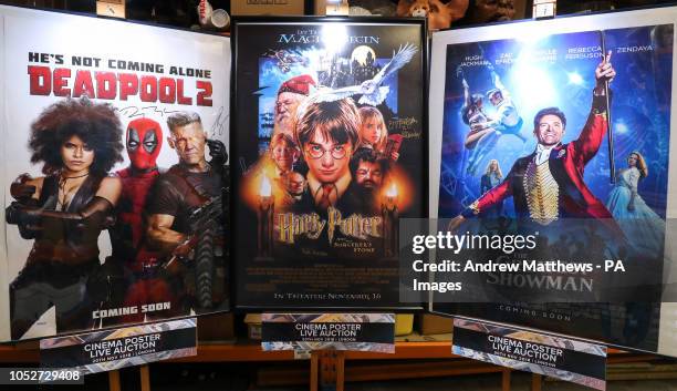 Movie posters for Deadpool 2, signed by Ryan Reynolds and Josh Brolin, Harry Potter and the Sorcerer's Stone, signed by Daniel Radcliffe, Rupert...