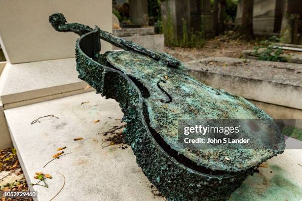 Violin Grave at Pere Lachaise Cemetery -the largest cemetery in Paris and is notable for the final resting place for many celebrities, artists,...