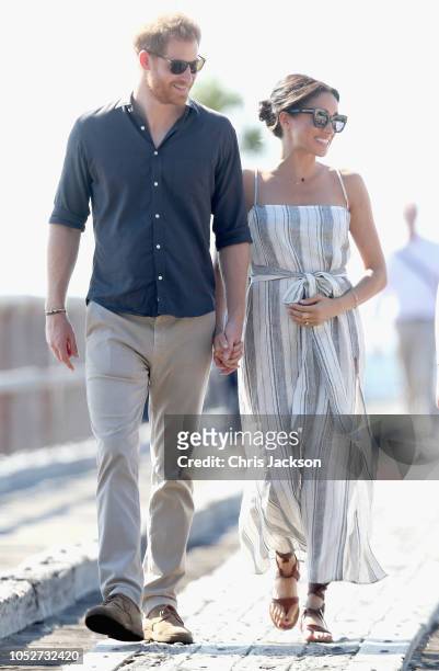 Prince Harry, Duke of Sussex and Meghan, Duchess of Sussex walk along the picturesque Kingfisher Bay Jetty on October 22, 2018 in Fraser Island,...