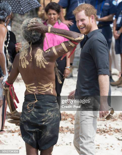 Prince Harry, Duke of Sussex meets a local elder as he visits Lake McKenzie on October 22, 2018 in Fraser Island, Australia. The Duke and Duchess of...