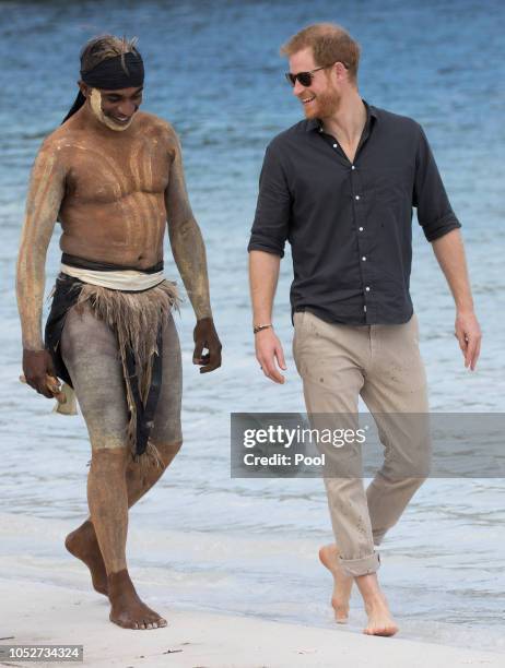 Prince Harry, Duke of Sussex meets a local elder as he visits Lake McKenzie on October 22, 2018 in Fraser Island, Australia. The Duke and Duchess of...