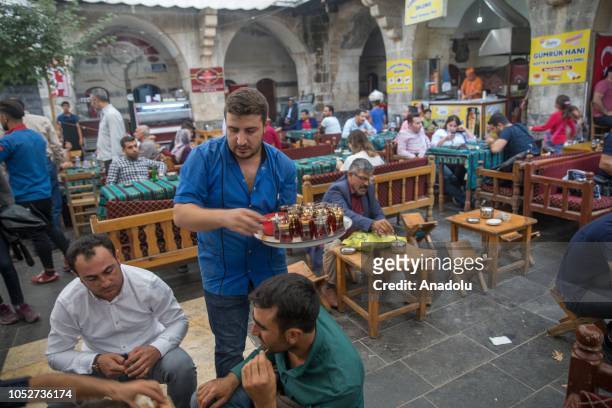 People are seen at teahouse of the historical Gumruk inn built in the period of Sultan of the Ottoman Empire Suleiman the Magnificent, in Sanliurfa,...