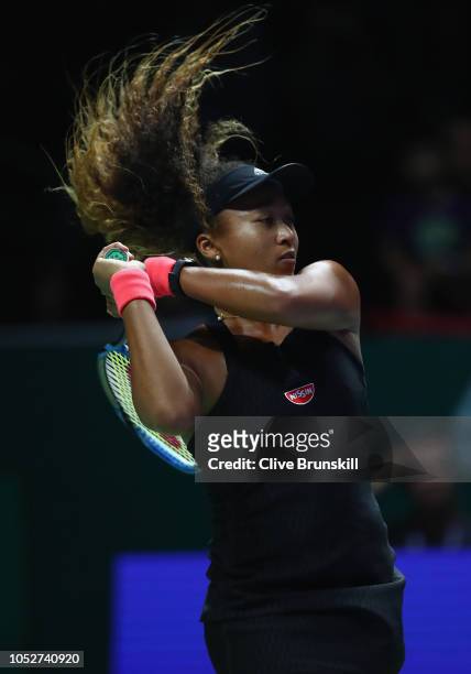 Naomi Osaka of Japan plays a backhand in her singles match against Sloane Stephens of the United States during day 2 of the BNP Paribas WTA Finals...