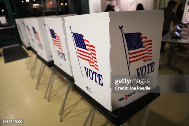 Voting booths are setup at the Yuengling center on the campus of University of South Florida as workers prepare to open the doors to early voters on...