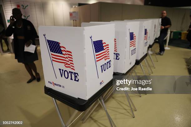 Voting booths are setup at the Yuengling center on the campus of University of South Florida as workers prepare to open the doors to early voters on...