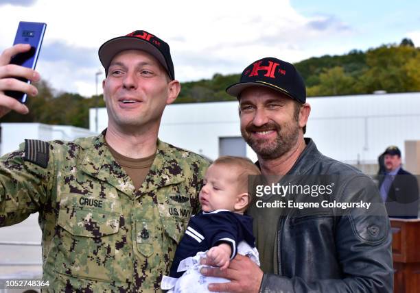 Actor Gerard Butler poses for a photo with sailors and families during Hunter Killer cast visit to Naval Submarine Base New London on October 20,...