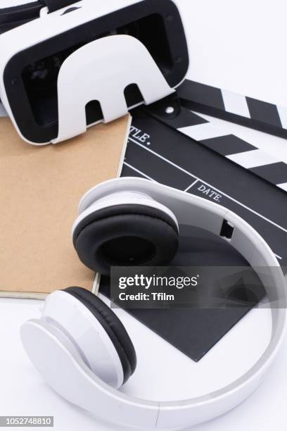 earphone, movie clapper board, note pad and with vr player on white background - film director asian stock pictures, royalty-free photos & images